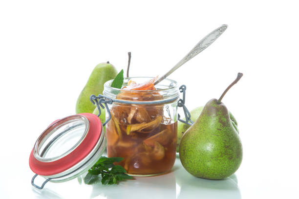 istock sweet fruit jam with apples and pears in a glass jar 1059128376