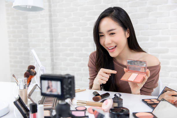 istock Pretty asian Blogger making a demonstration video about cosmetics and makeup. 1059130806