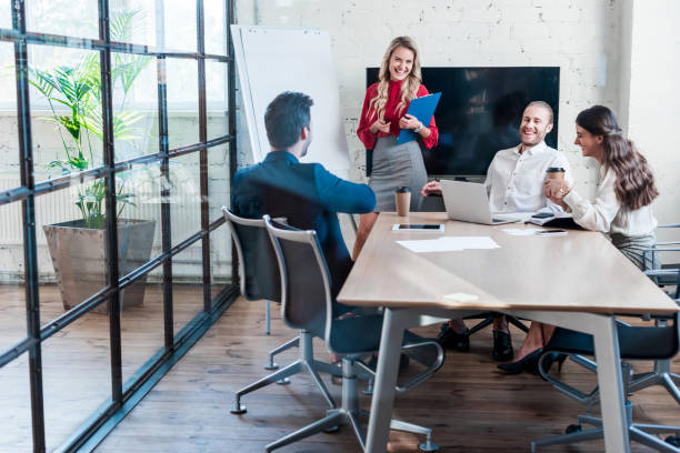 istock cheerful businesspeople having meeting in office 1059134608
