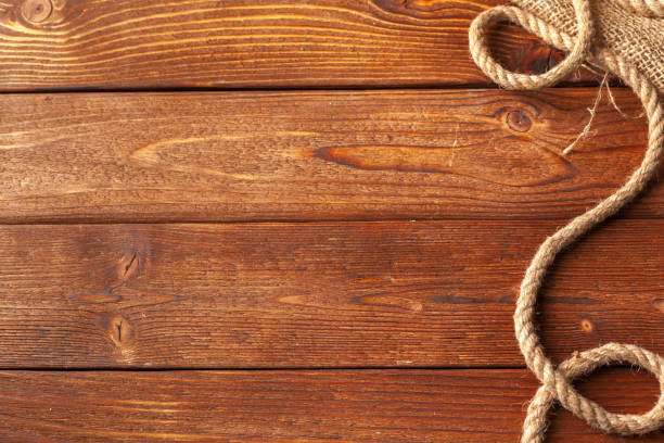 istock ship rope at wooden background 1059134742