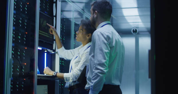 istock IT engineers with devices coworking in data center 1059137298