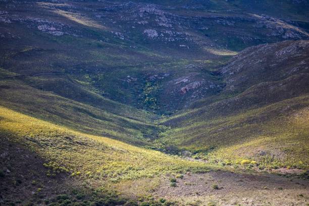 shadows of clouds over a massive mountain range - somerset west, western cape, south africa. - somerset west imagens e fotografias de stock