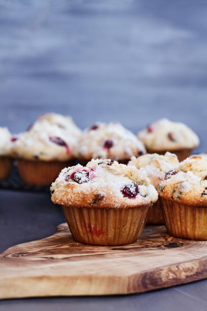 istock Cranberry Muffins on a wood cutting board 1059143800
