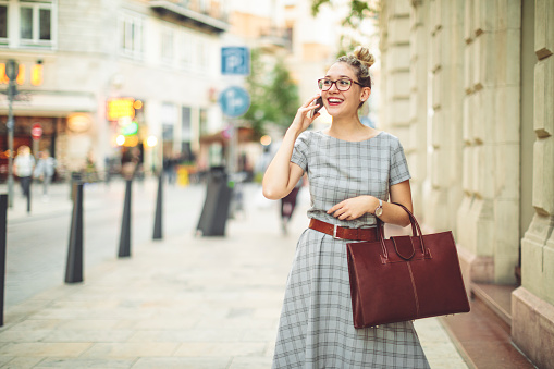 Young woman is having fun in the city - autumn mood