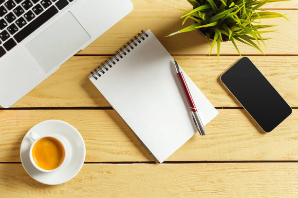 istock Office table background with coffee cup, pencils and computer keyboard. Business workplace or workspace concept. 1059144842