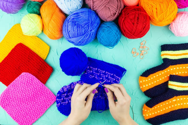 istock girl knits sock knitting needles 1059146864