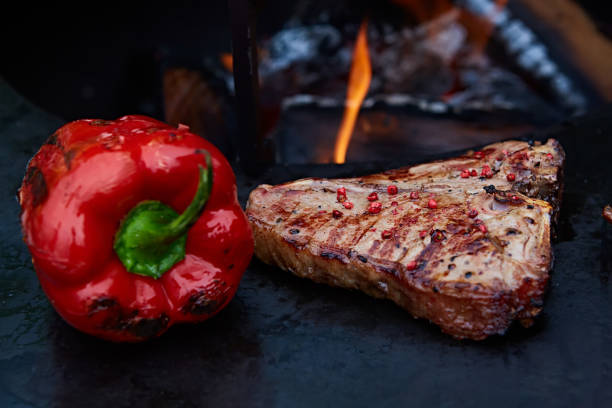 istock Grilled T-Bone Steak on serving board on wooden background 1059146884