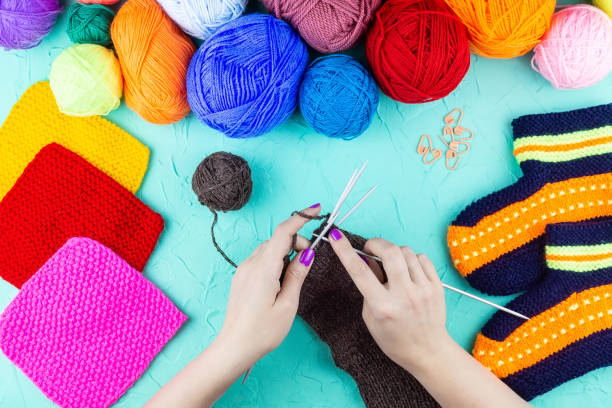 istock girl knits sock knitting needles 1059146922
