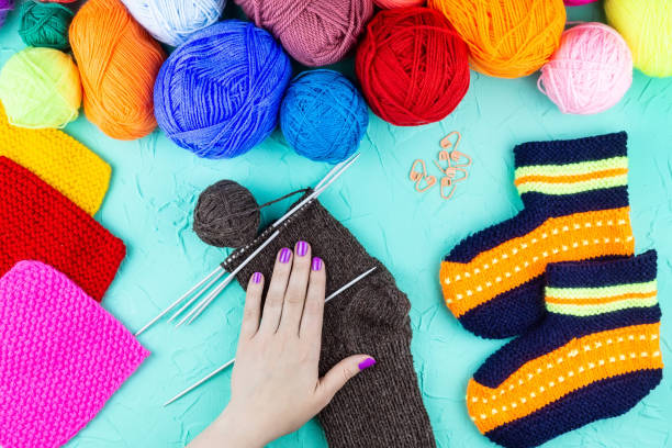 istock girl knits sock knitting needles 1059146978