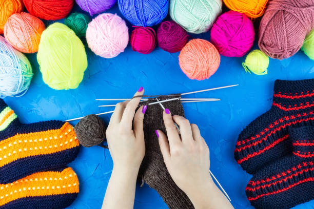 istock girl knits sock knitting needles 1059146980