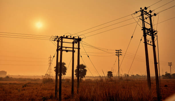 istock Powerline silhouettes against orange sunset 1059146988