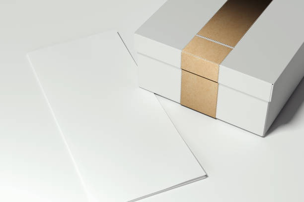 istock White cardboard box with golden ribbon on white background. 3d rendering. 1059147150
