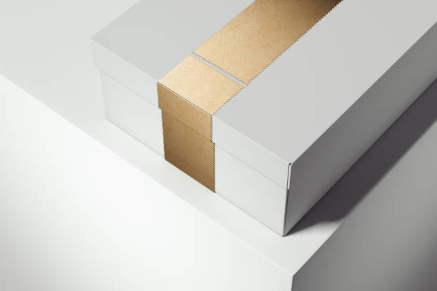 istock White cardboard box with golden ribbon on white background. 3d rendering. 1059147176