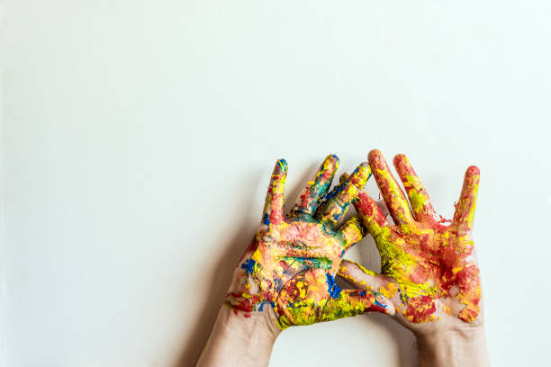istock Photo of hands dirty with paint 1059149514