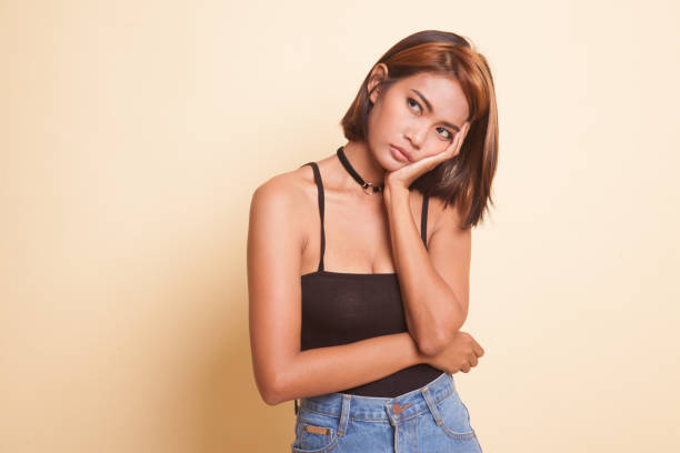 istock Beautiful young Asian woman get bored. 1059150596