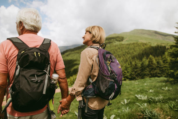 istock Active seniors hiking together 1059156698