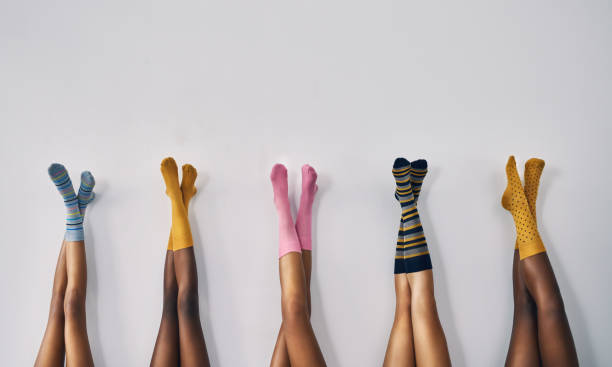 Fashion starts at your feet Cropped studio shot of a group of women’s legs in a row wearing socks sock photos stock pictures, royalty-free photos & images