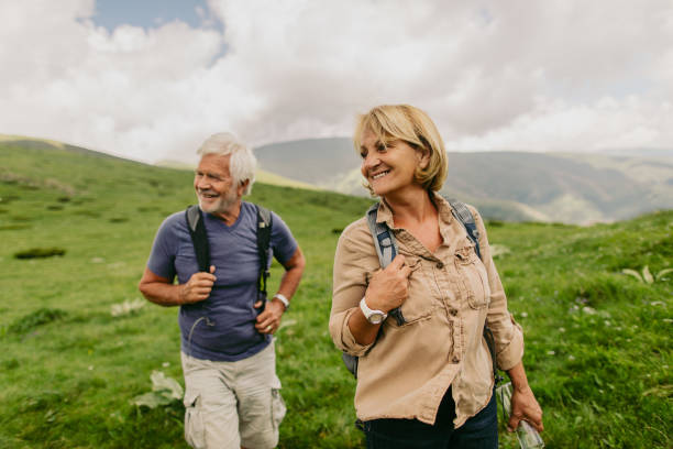istock Smiling senior couple hiking 1059158588