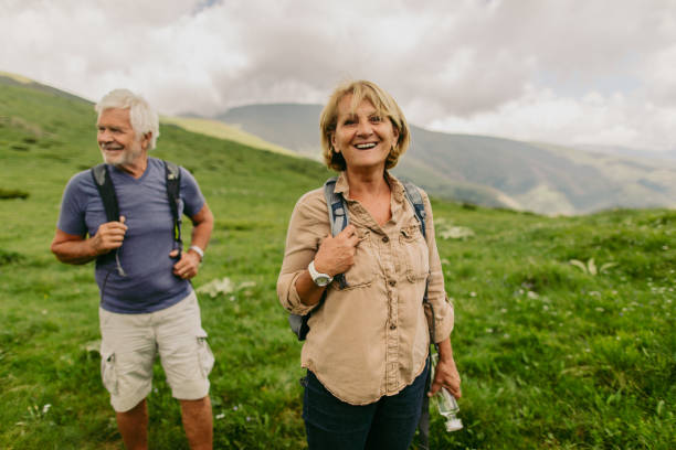 istock Smiling senior couple hiking 1059158750
