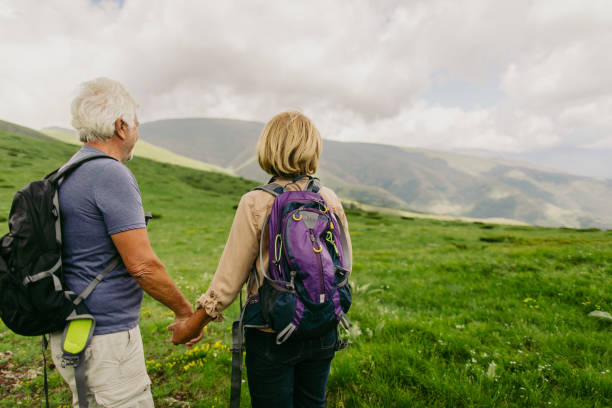 istock Active seniors hiking together 1059158836