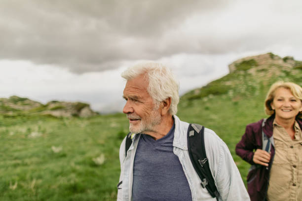 istock Smiling senior couple hiking 1059162086