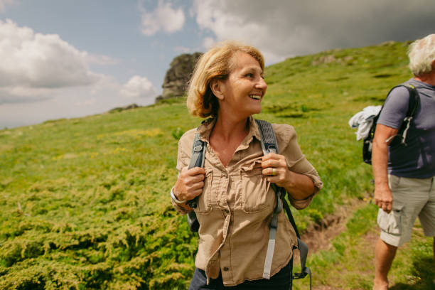 istock Smiling senior couple hiking 1059162284