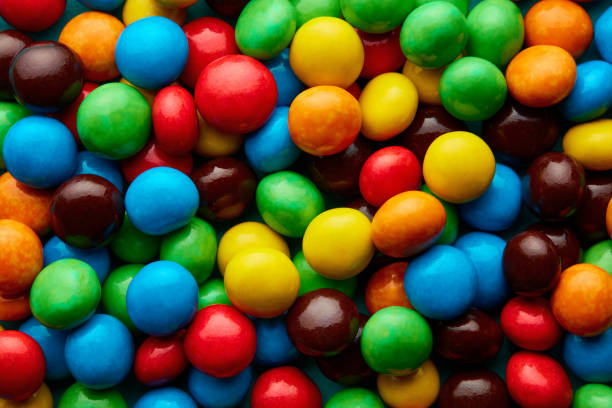 Top down view of delicious sugar coated chocolate pills with vibrant colors