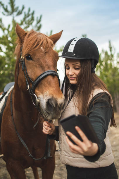 istock Girl making selfie with horse 1059163146