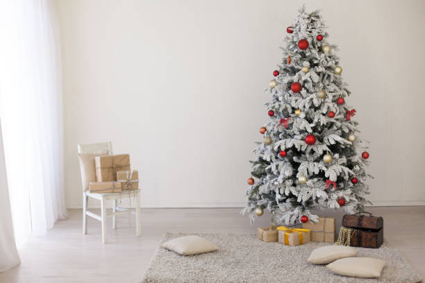 istock Christmas Decor White Christmas tree with gifts 1059165976
