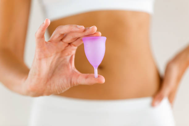 istock Young woman hands holding menstrual cup on the bathroom. 1059166314