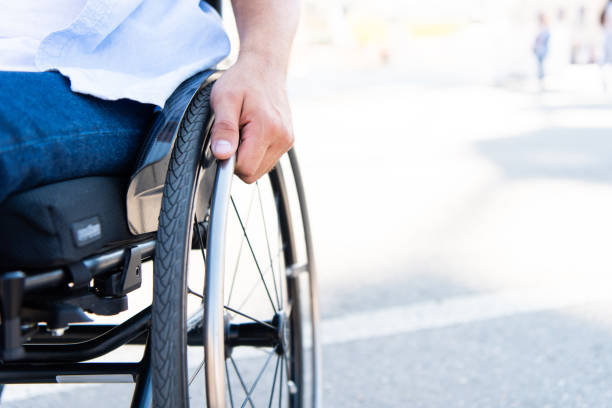 istock cropped image of man using wheelchair on street 1059170740