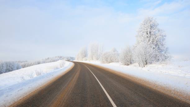 istock Rural winter highway on a sunny day 1059171474