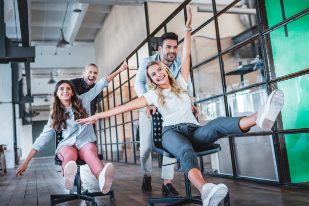 istock happy young coworkers having fun together at workspace 1059172580