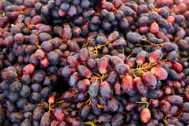 Close up pile of red grape on the market counter