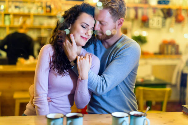 istock Romantic couple having date in coffee shop 1059177542