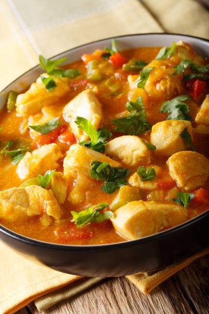 istock Bobo chicken with vegetables in coconut milk close-up in a bowl. vertical 1059181444