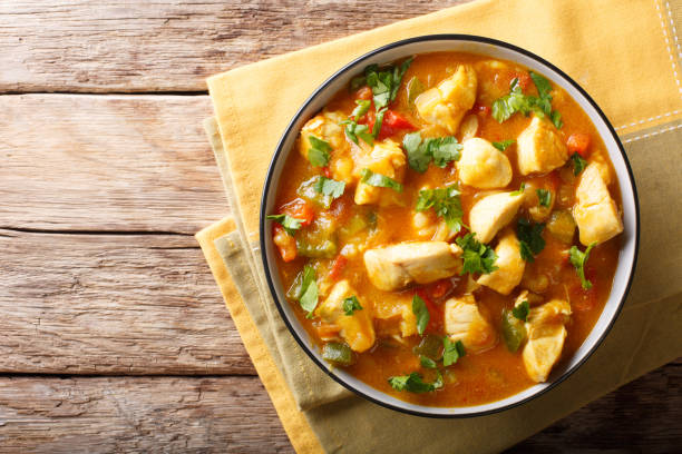 istock Bobo chicken with vegetables in coconut milk close-up in a bowl. horizontal top view 1059181748