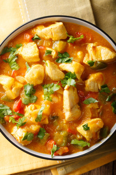 istock South American Food: Bobo chicken stew with vegetables in coconut milk close-up. Vertical top view 1059182842