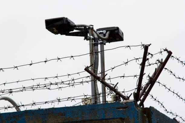 istock Barbed wire on the fence 1059184268