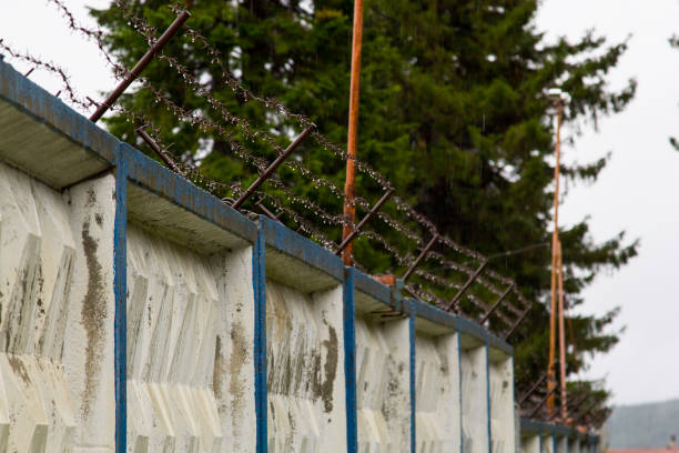 istock Barbed wire on the fence 1059184542