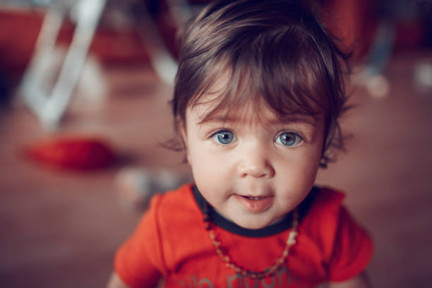 istock baby girl with blue eyes 1059187400