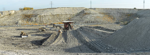 istock chalk mine with stone crusher and conveyor belt. mining industry. 1059187534