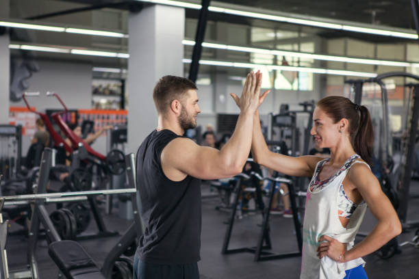istock Man and woman giving high five. 1059187916