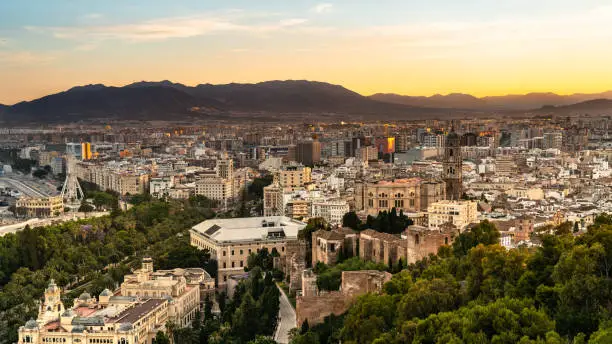 Aerial panoramic view of Malaga city, Andalusia, Spain during beautiful sunset