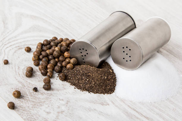 istock Metal salt and pepper shaker on white background 1059196728