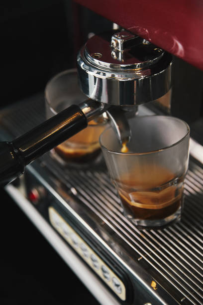 istock professional coffee machine and two glasses with espresso 1059196850