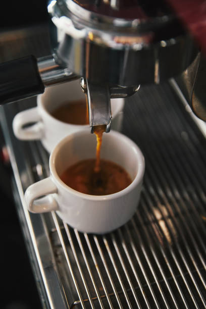 istock close-up view of coffee maker and two cups with espresso 1059196930