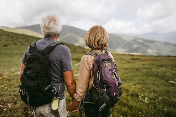 istock Active seniors hiking together 1059197234