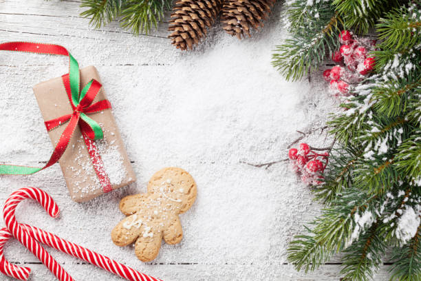 istock Christmas gift, gingerbread man, candy canes and fir tree 1059200506