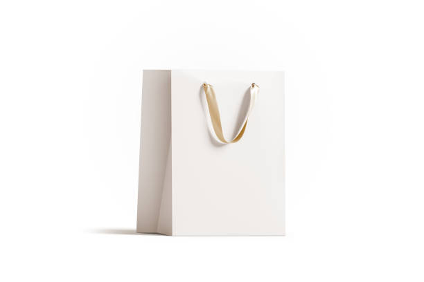 Blank white paper gift bag with gold silk handle mockup, 3d rendering. Empty shopping packet mock up, isolated. Clear plastic bag for purchase or present. Beautiful craft package template.